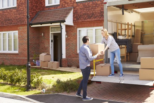 Removal team preparing household items for a UK move