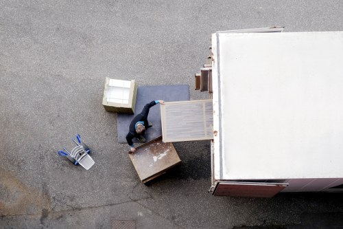 Professional movers carrying furniture in a Tufnell Park property