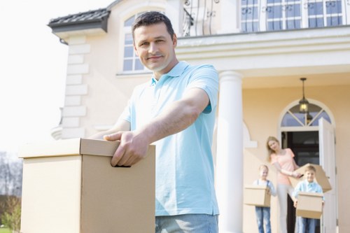 A removal team handling furniture and belongings with care during a move