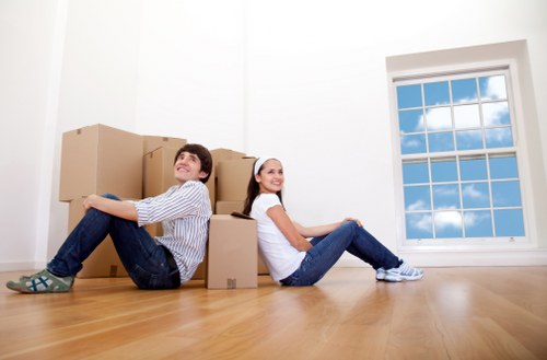 Professional removals team working safely and carefully