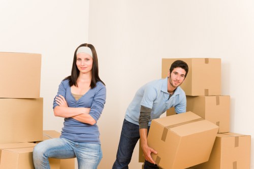 Team carrying a sofa through a protected doorway