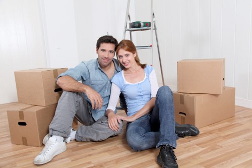 House removalists in Tufnellpark loading furniture into a moving vehicle