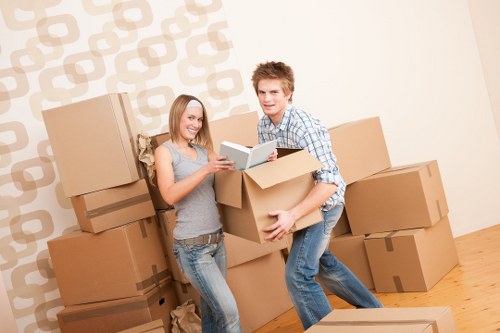 Movers carrying furniture during a same day relocation