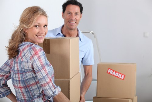 Removal team loading furniture into a van